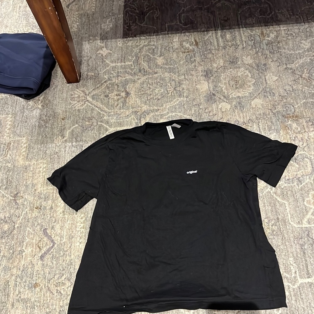 black shirt with one word